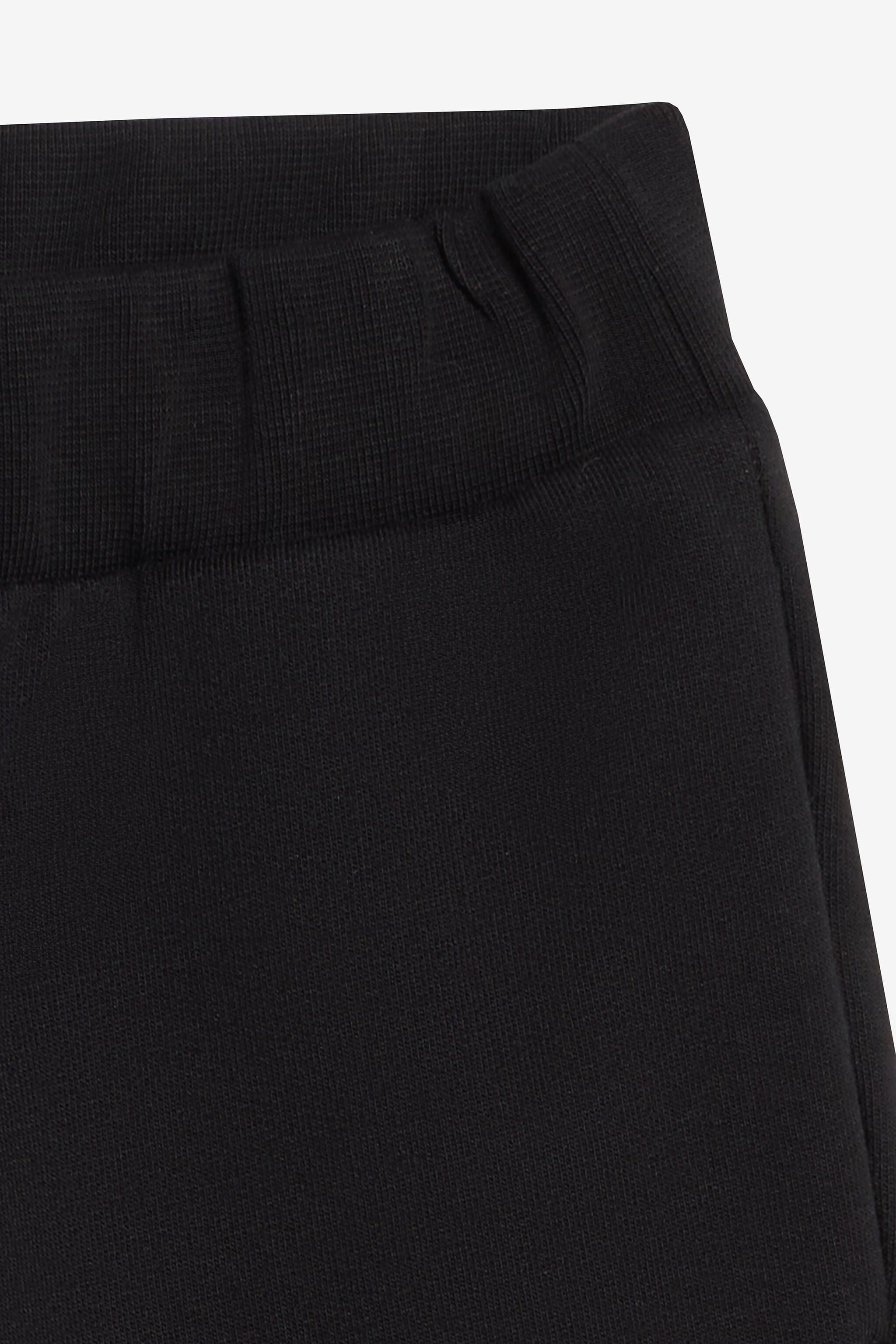 JU Jogger À Imprimé Roses Sur Une Jambe JU Jogger À Imprimé Roses Sur Une Jambe Noir UJT23A-CF050