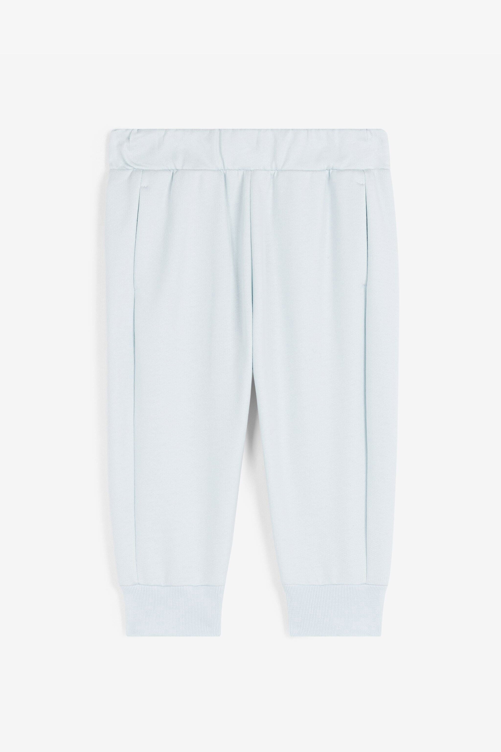 JU Pantalón de chándal de algodón con monograma RC JU Pantalón de chándal de algodón con monograma RC Azul claro RJT212-CF050
