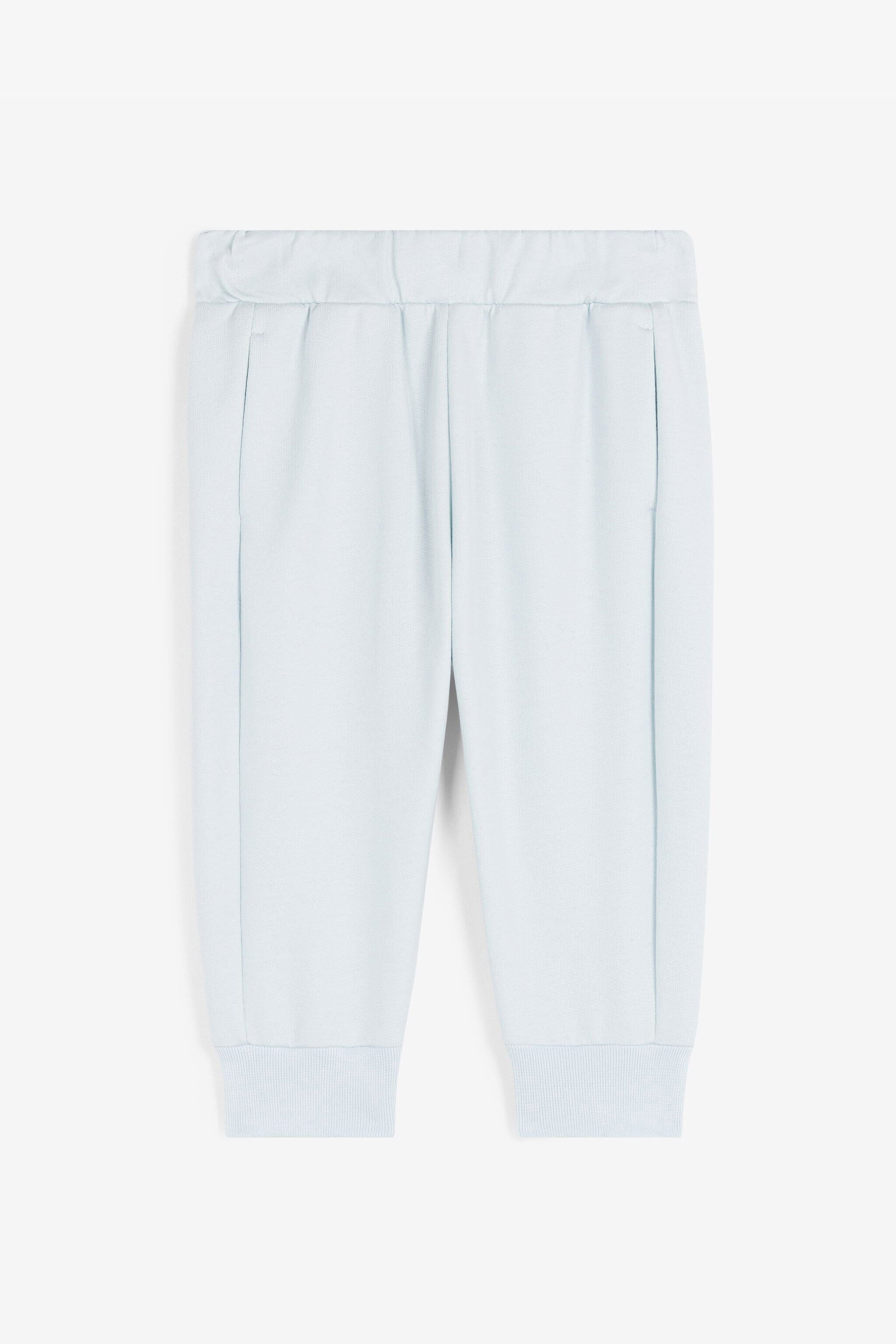 JU RC Monogram-Print Cotton Track Pants Light blue RJT212-CF050