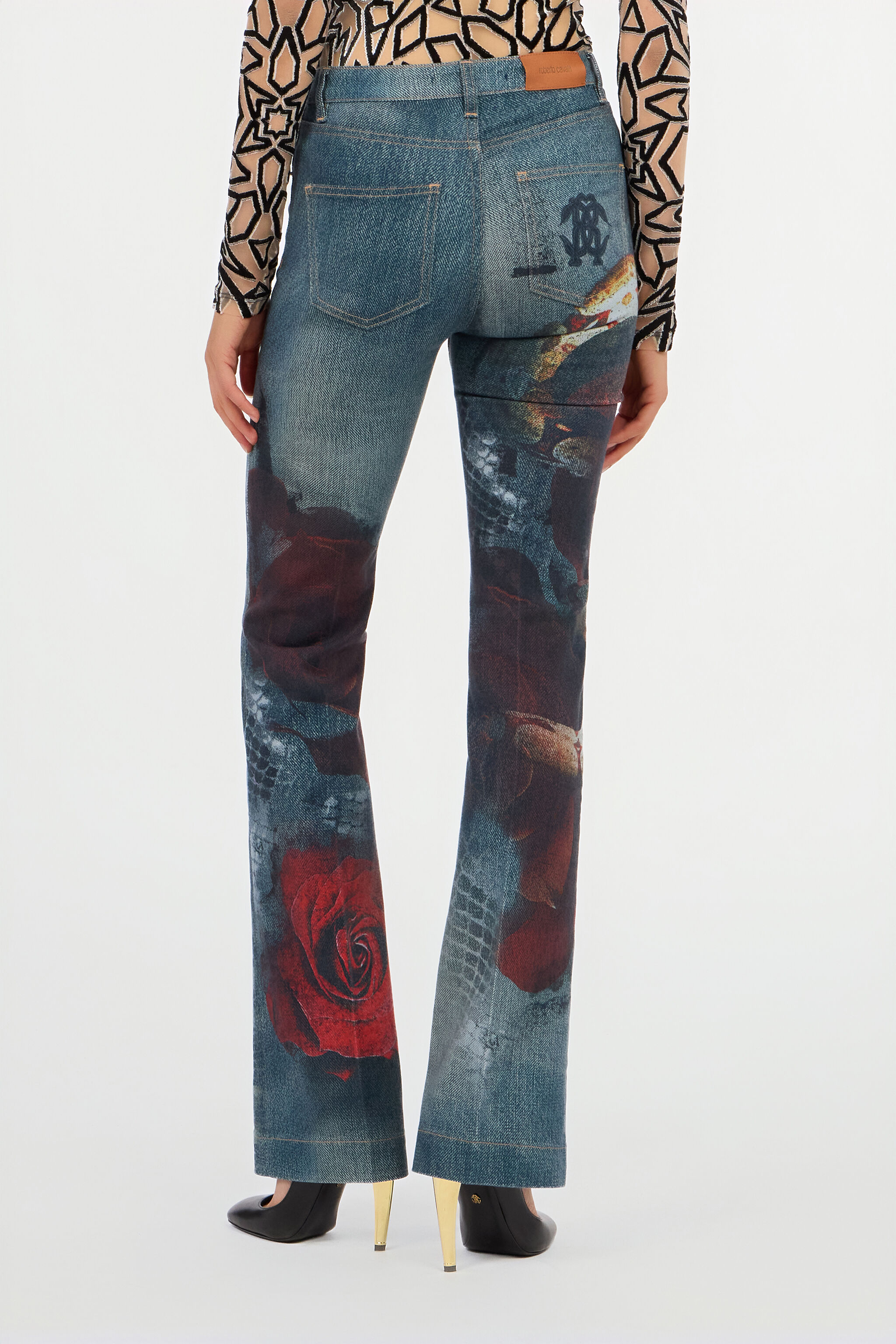 パンツ roberto cavalli archive flare denim Roberto Cavalli Rubber Printed Flared Jeans A pair of light-wash