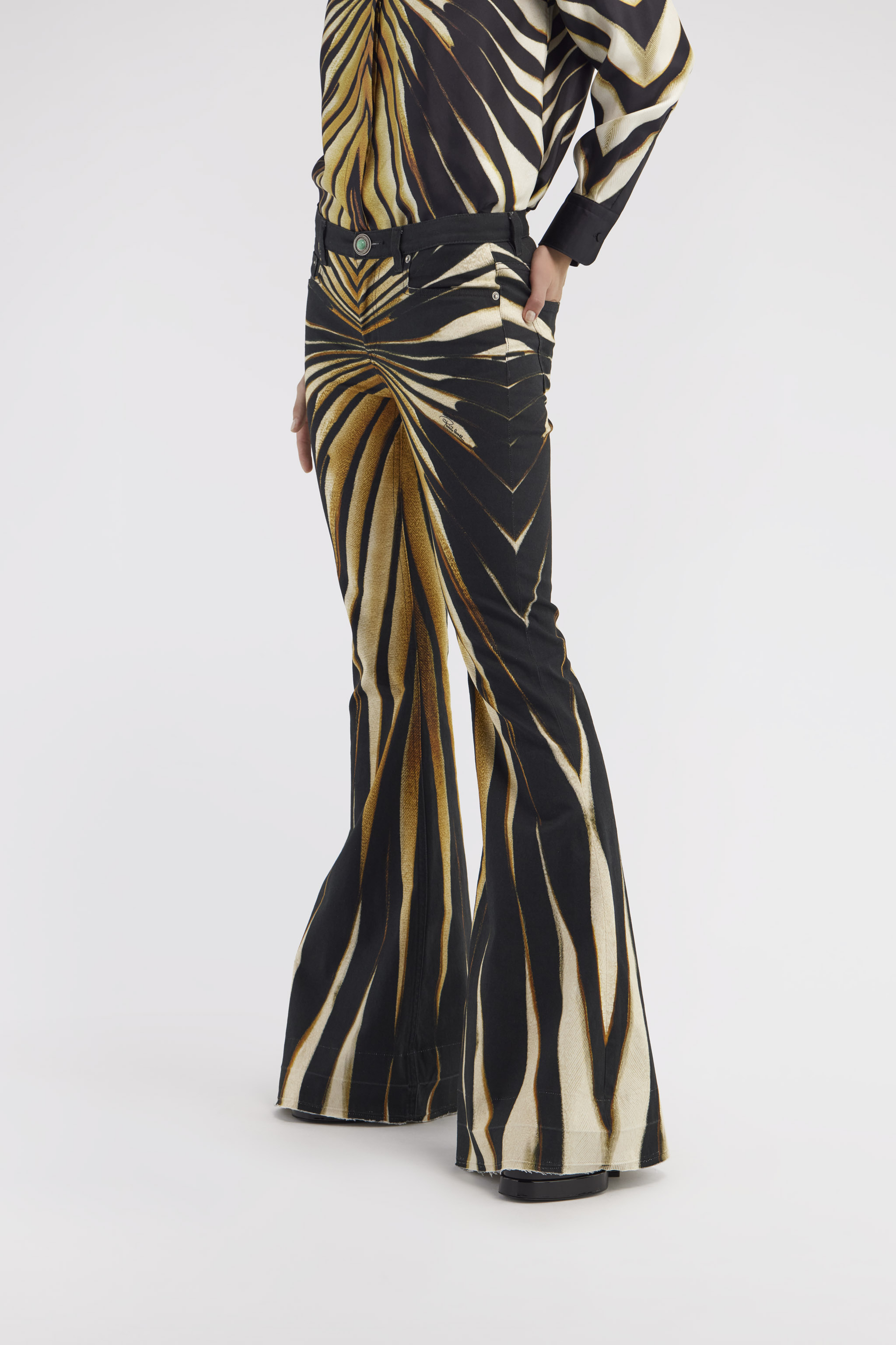 Flared jeans with Ray of Gold print